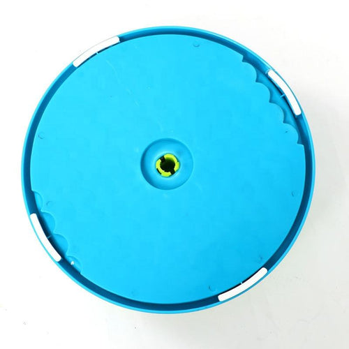 Blue plastic disc with a central hole on a white background