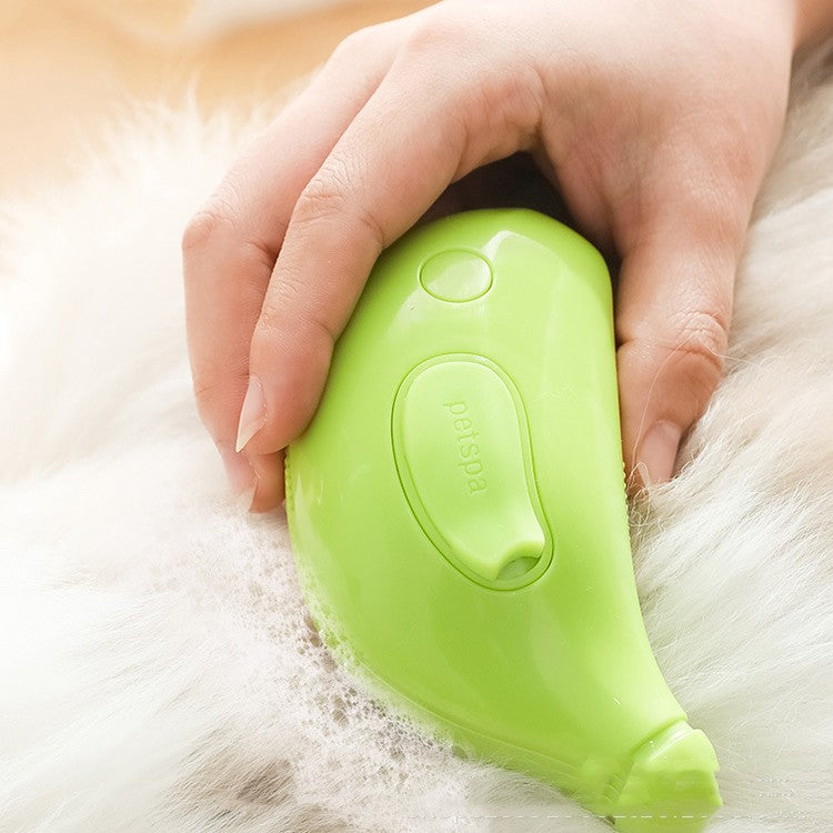 Green pet grooming tool being used on a pet's fur