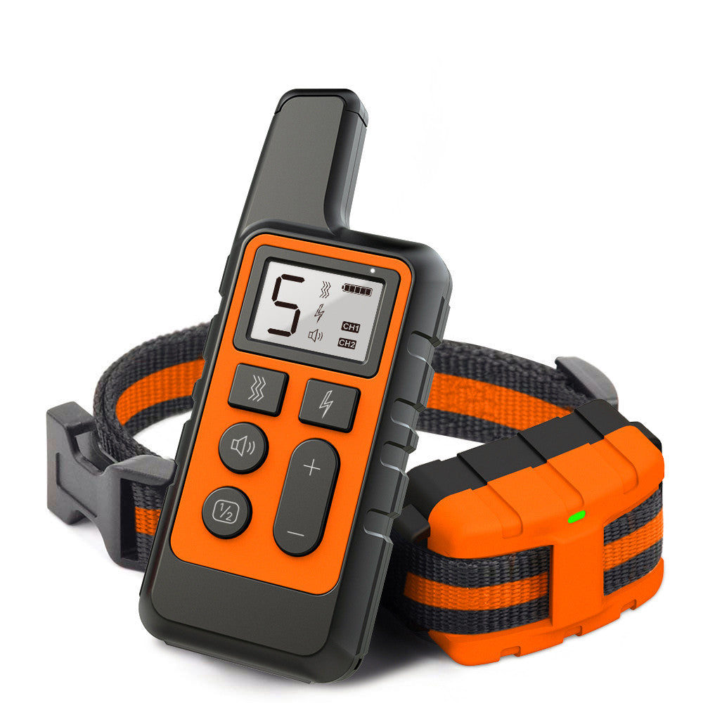 A pet training remote control and collar set in orange and black, shown on a clean white background. The remote features a digital screen and multiple buttons, while the collar includes an orange and black adjustable strap and a matching battery-operated transmitter unit.