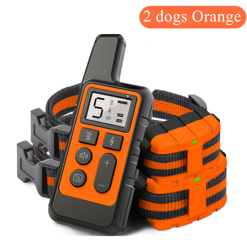 Orange and black dog training collar with remote control on a white background