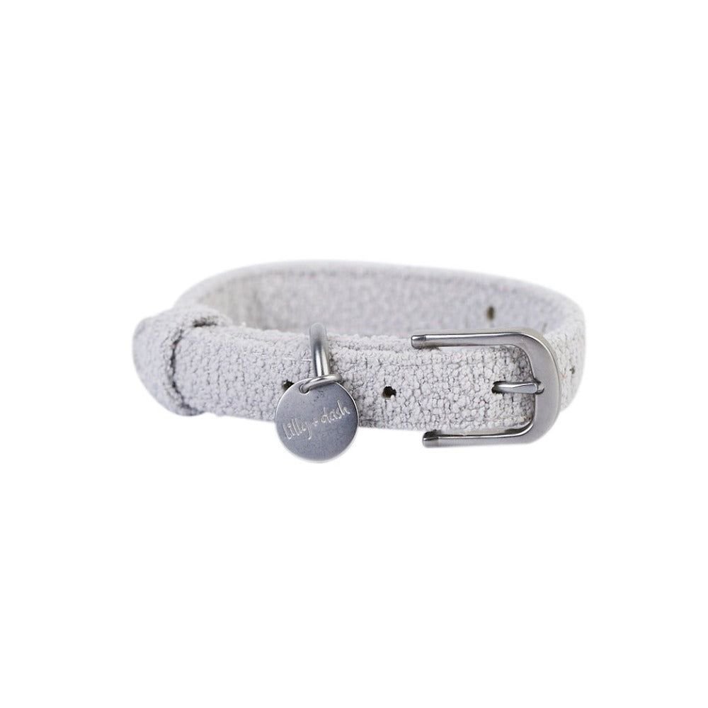 A light gray textured leather dog collar with a silver metal buckle and a round silver tag engraved with 'Lily's 24h'.