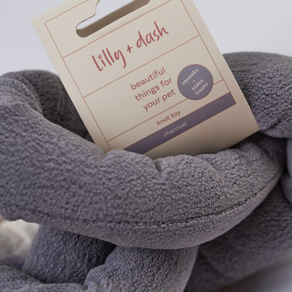 Gray pet knot toy with 'lilly & dash' label on a light background