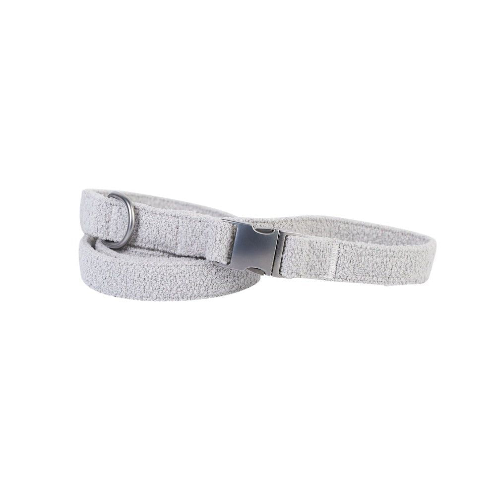 Gray textured belt with a silver buckle on a white background