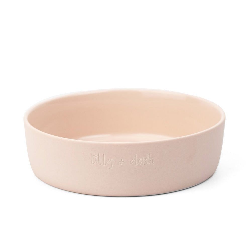 Pink ceramic bowl with 'killy & clark' branding on a white background