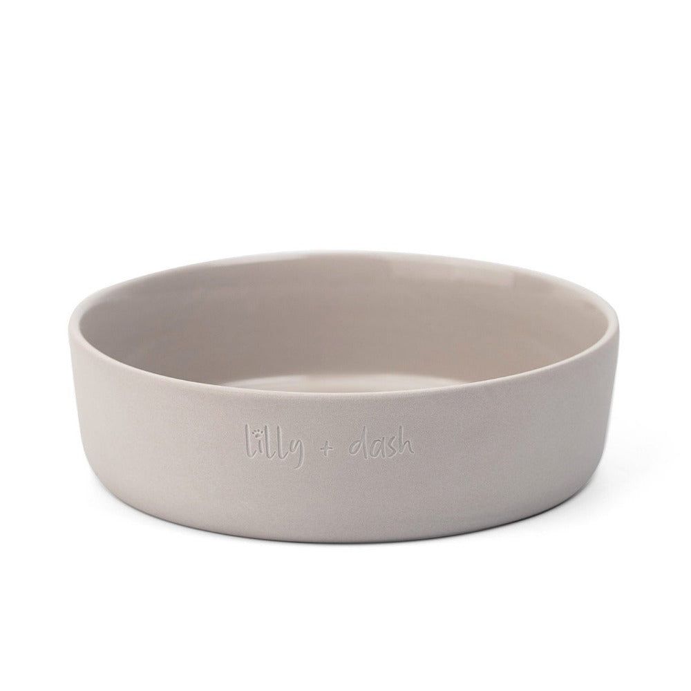 Beige ceramic bowl with 'billy & blush' branding on a white background
