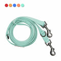 Light blue dog leash with metal clasps on a white background