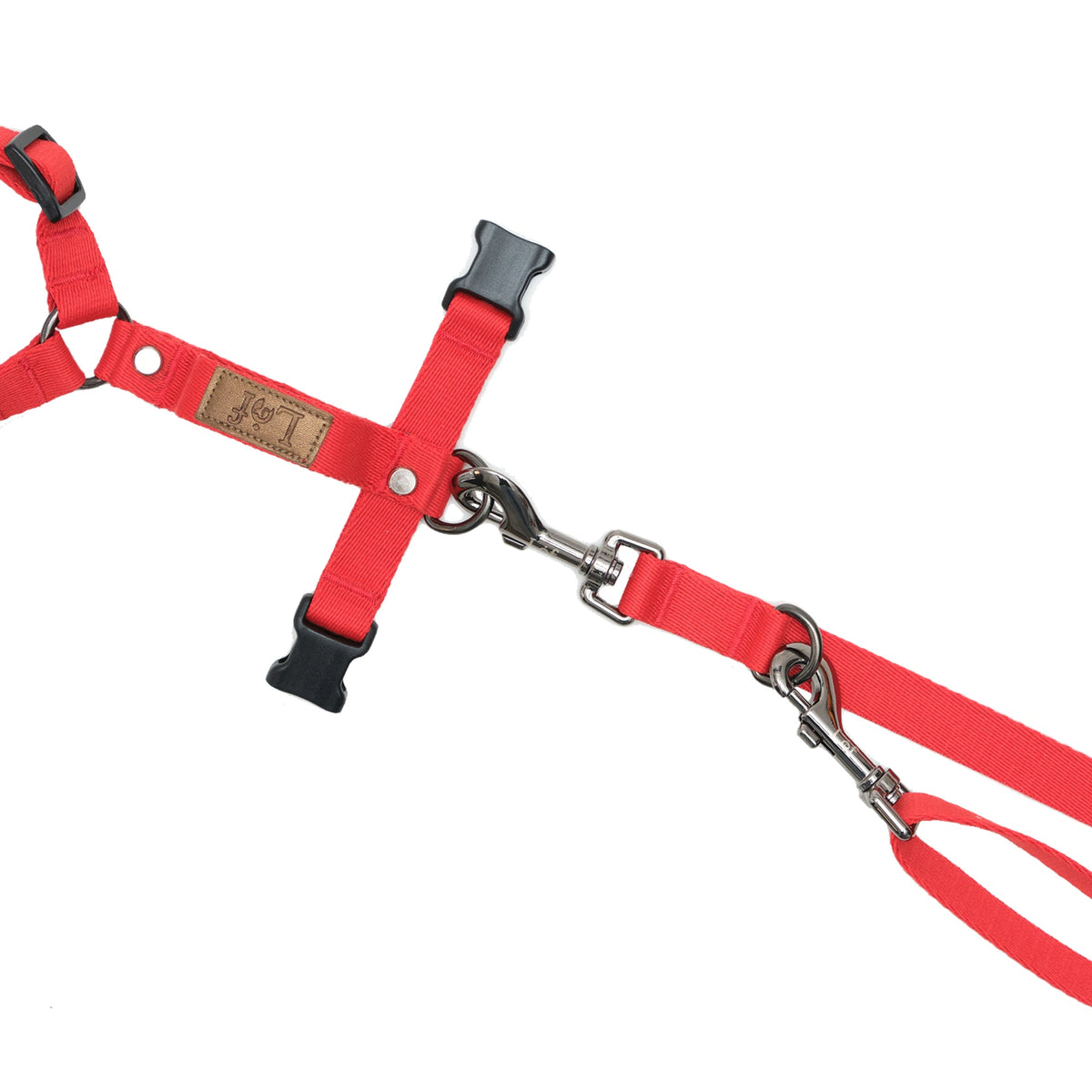 Red dog harness and leash set on a white background