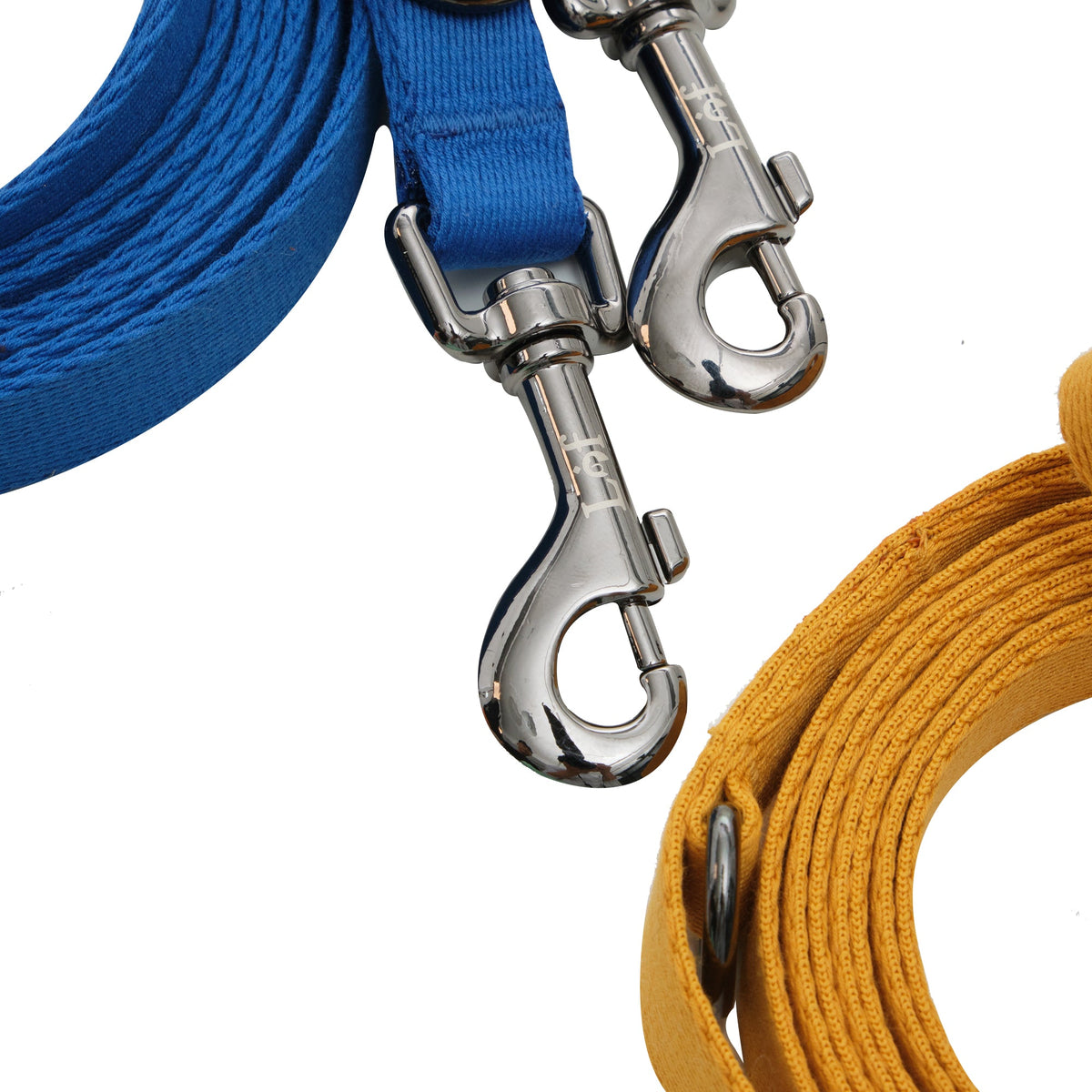 Blue and yellow dog leashes with metal clasps on a white background