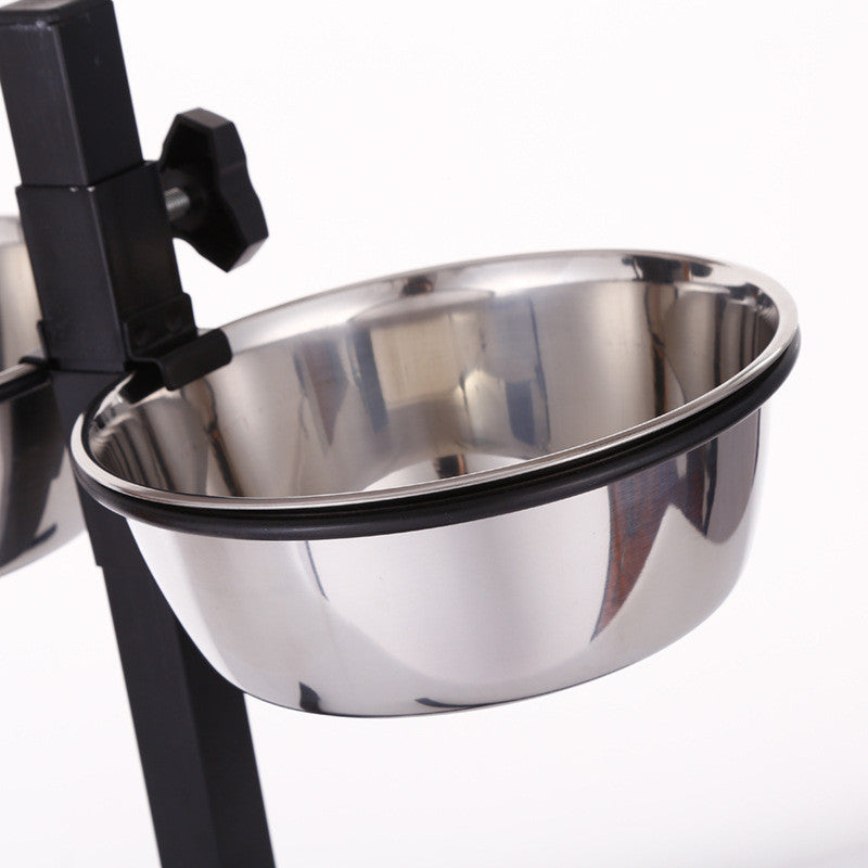 Stainless steel pet bowl on a black stand against a white background