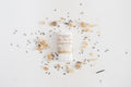 Skincare product with lavender flowers on a light background