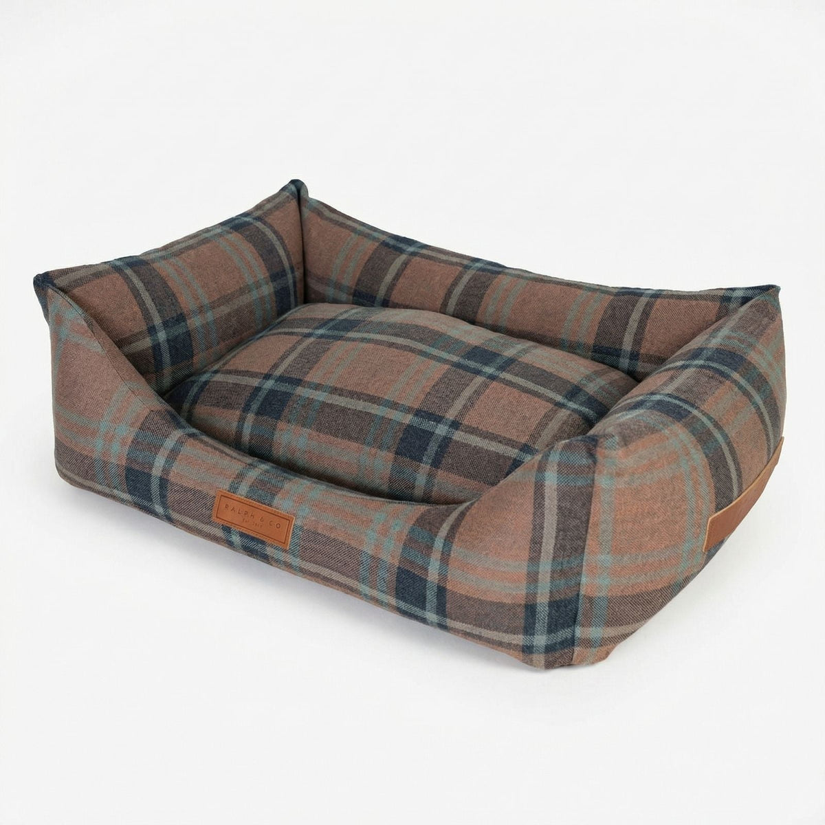 Plaid patterned pet bed on a white background