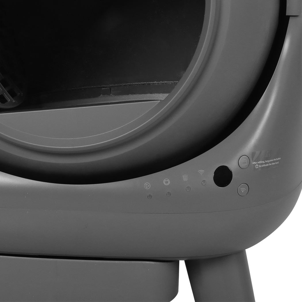 Close-up of a gray pet carrier with visible branding on a white background