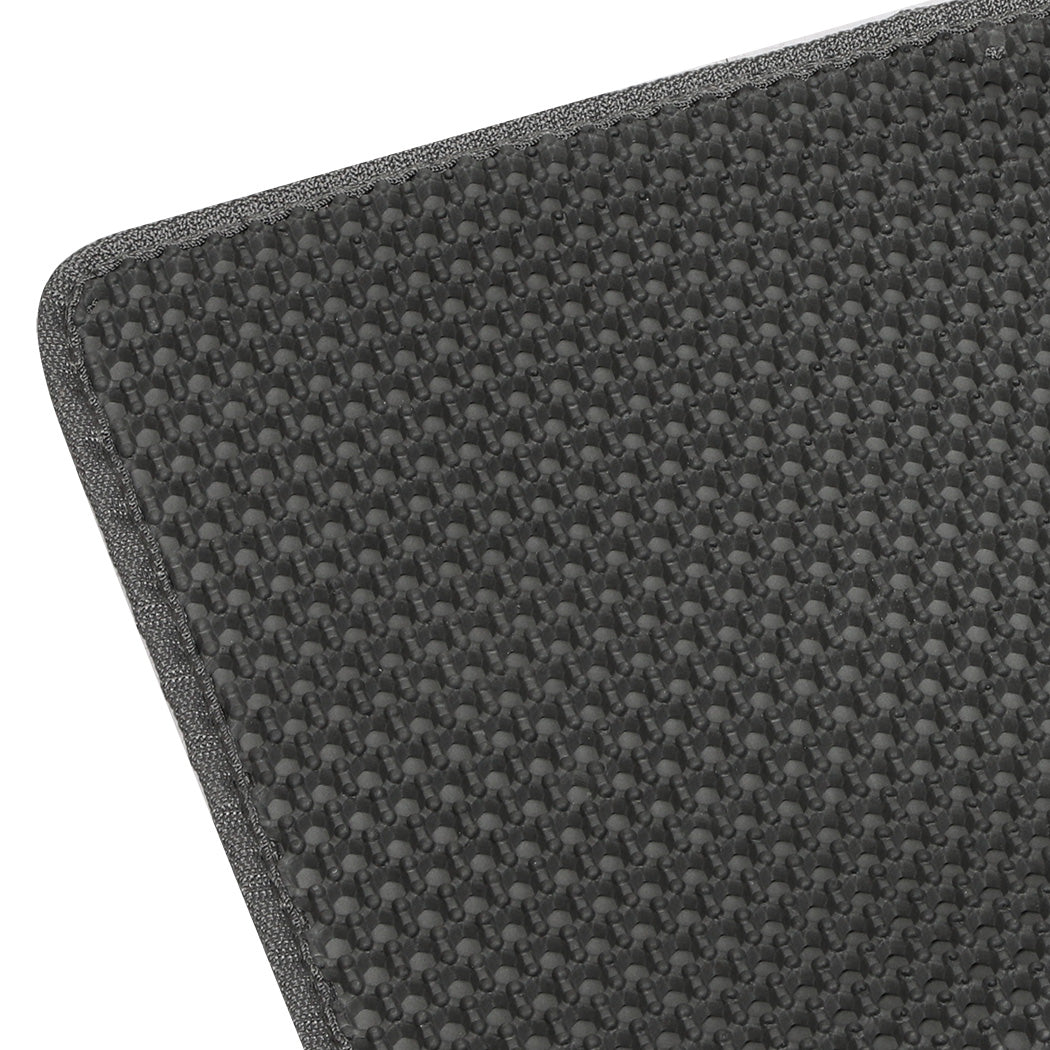 Close-up of a textured gray mat with a subtle pattern on a white background