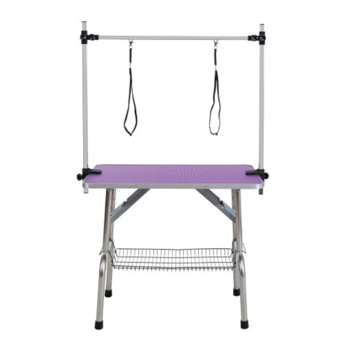 Pet grooming table with purple platform and metal frame on a white background
