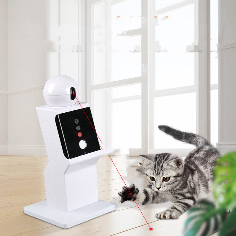 Pet toy with red laser pointer and cat interacting in a room.