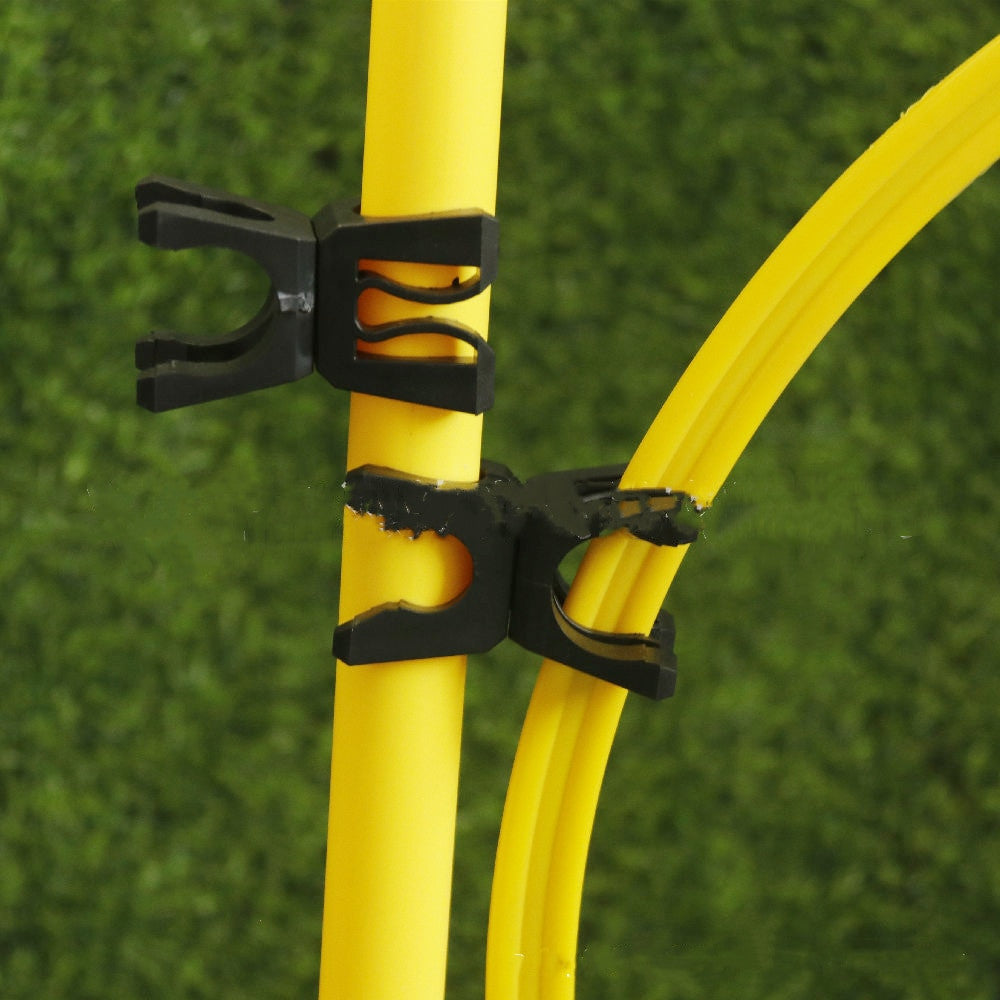 Close-up of a yellow bow with black string holders on a green grass background