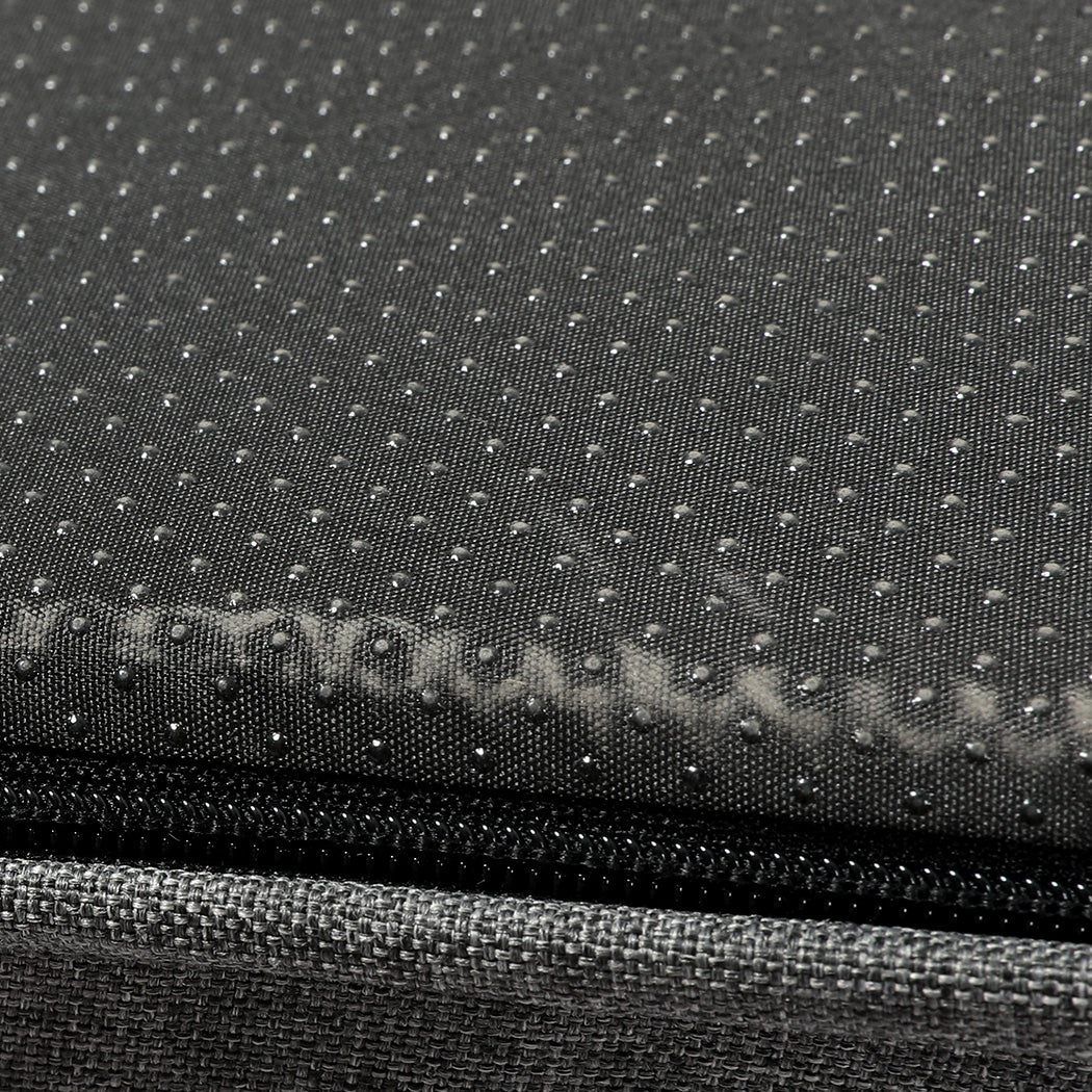 Close-up of a textured black surface with a zipper